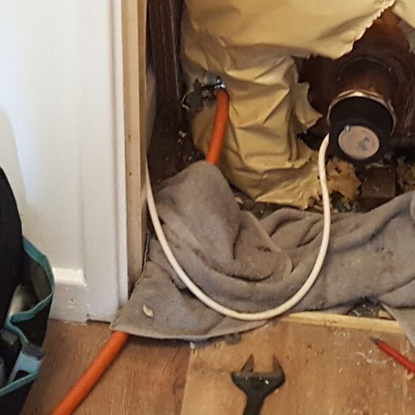 Orange hose connected to drain off