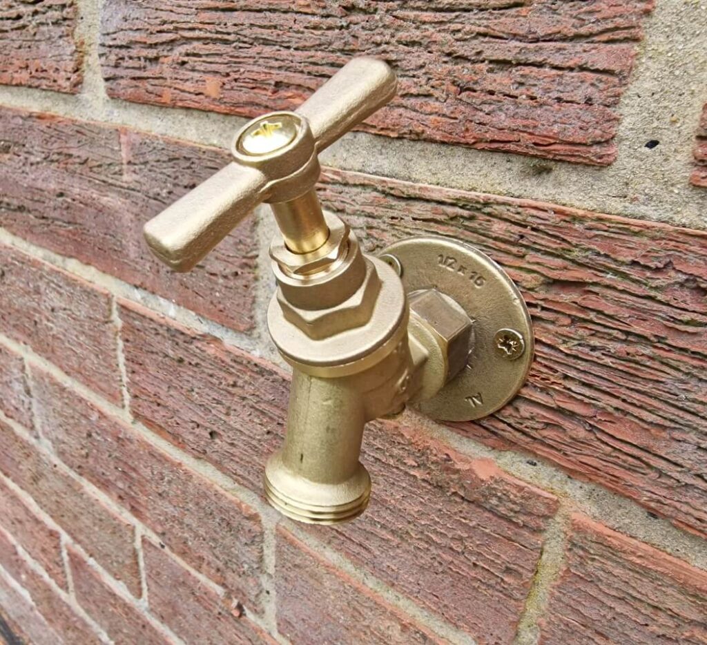 Outside tap fitted with hose connector removed