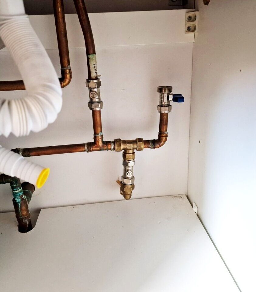 Outside tap pipe connected under sink