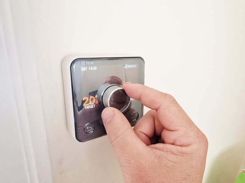 Hive room thermostat being set