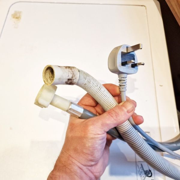 Disconnected washing machine pipes