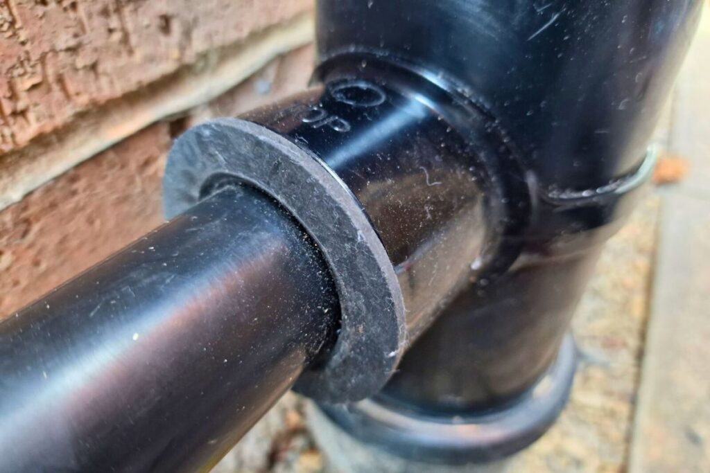 Strap boss fitted on soil pipe