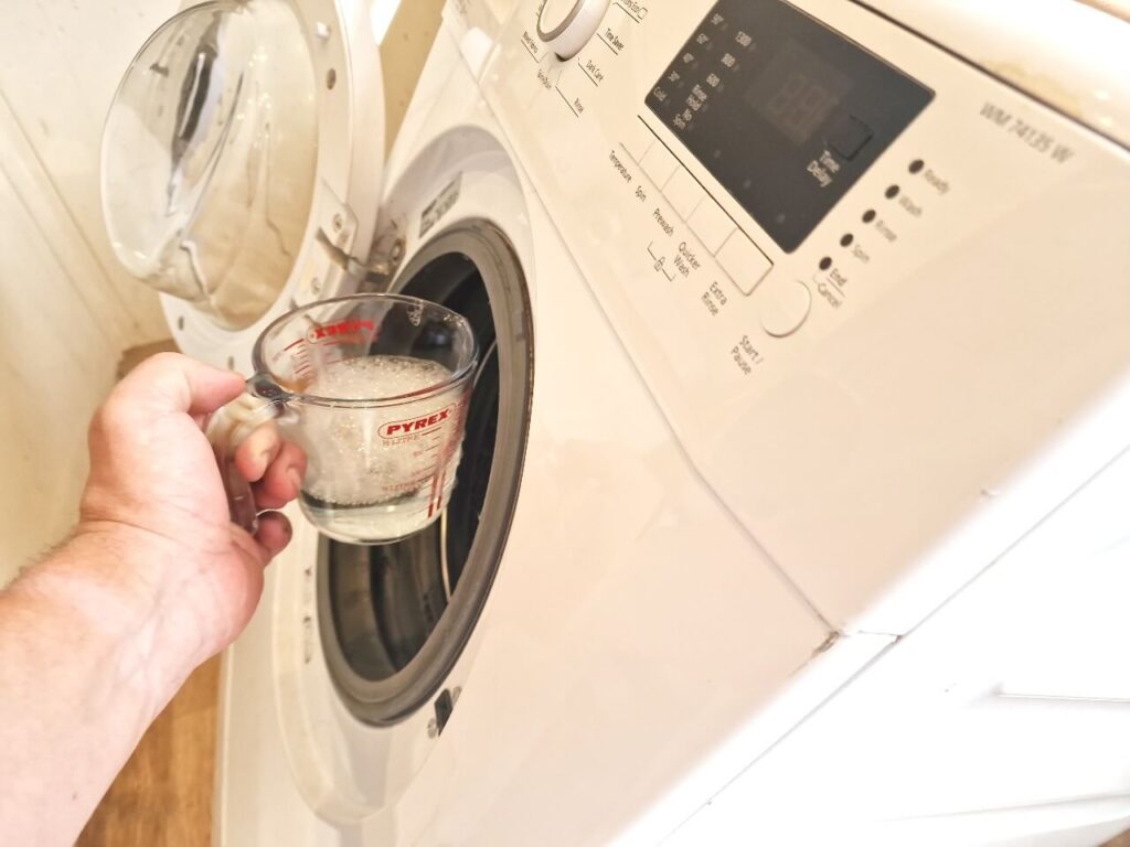 Scooping water from washing machine