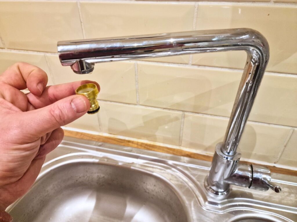 Attach hose connector to kitchen tap