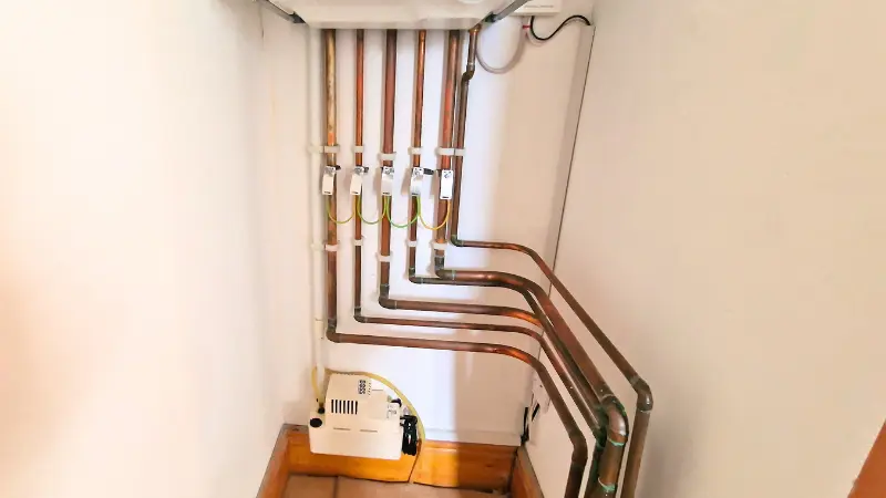 Condensate pump fitted below a boiler